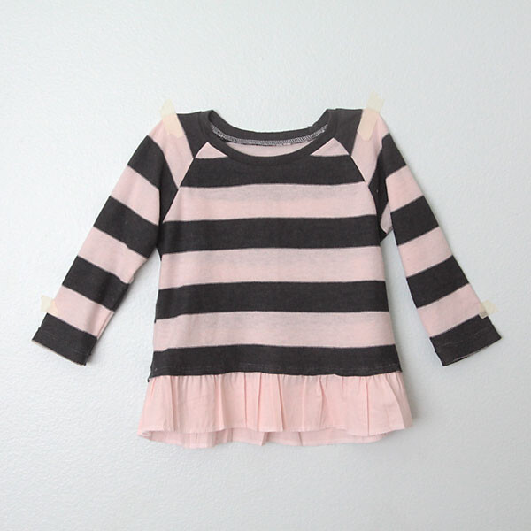 A striped girls top with a ruffled hem