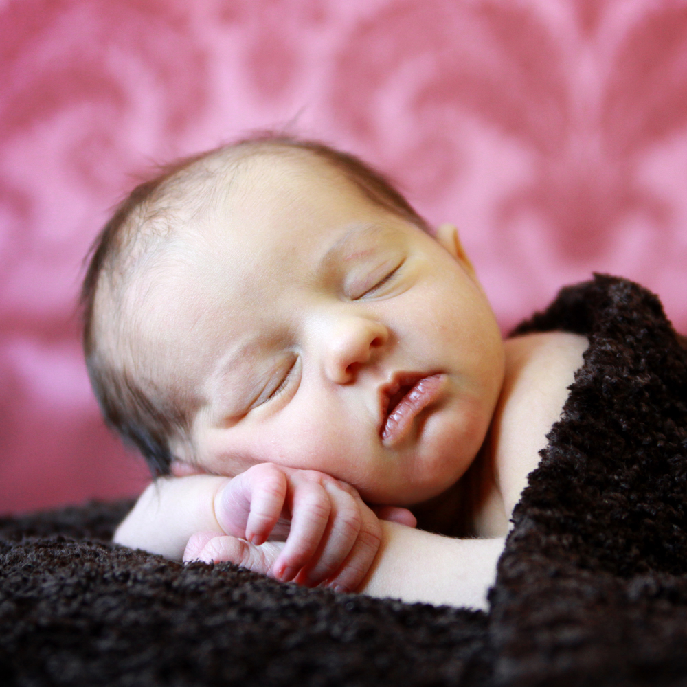 Portrait of cute baby lying on the bed at home, top view Stock Photo by  ©Rohappy 81522854