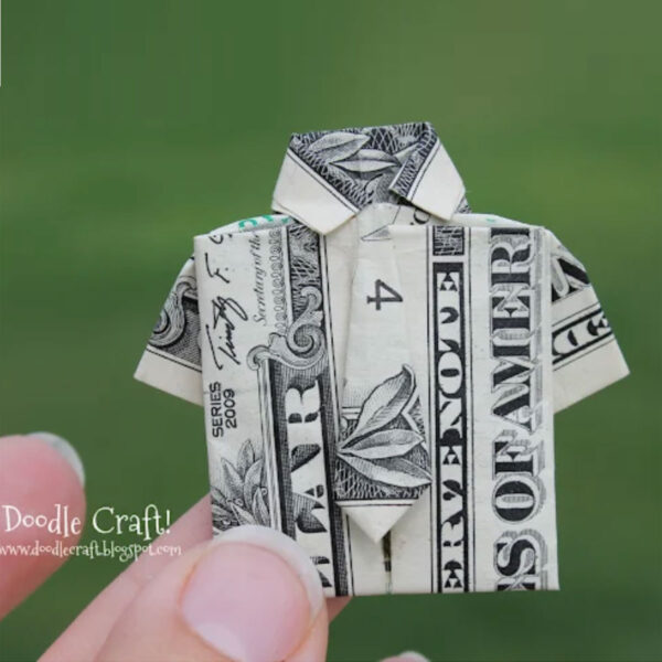 Dollar bill folded into a shirt.