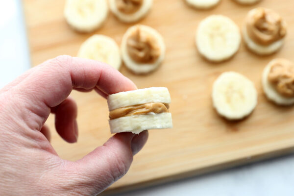 Banana placed on top to make banana peanut butter sandwich.