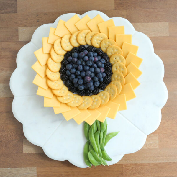 Charcuterie board in the shape of a sunflower.