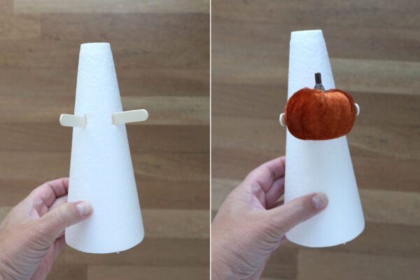 Foam cone with popsicle sticks stuck in it for arms.