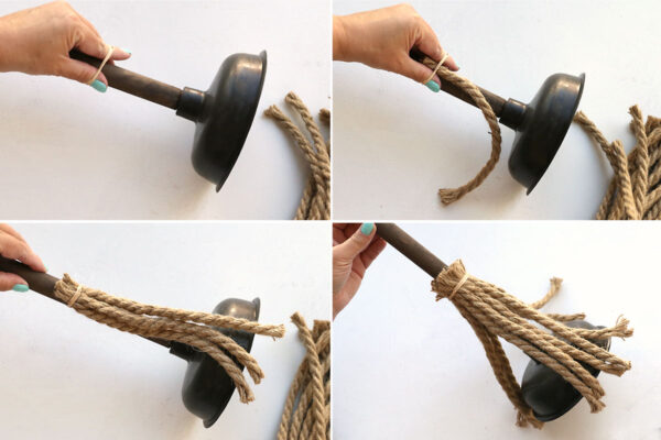 Placing rubber band around handle and tucking rope into it.