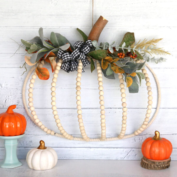 Beaded pumpkin wreath with smaller pumpkins.