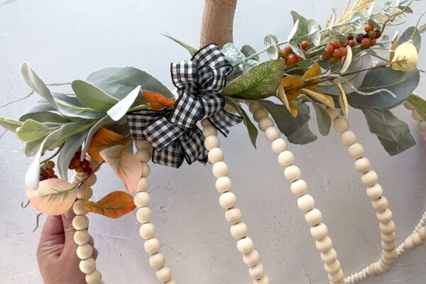 Bow attached to the top of the wreath.