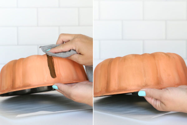 Applying wax and rubbing it off the bundt pan.