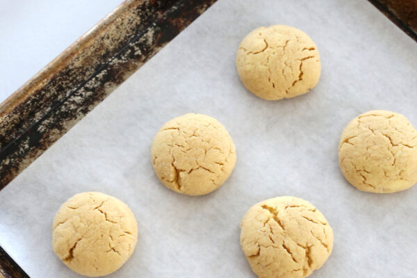 Baked peanut butter cookies cracked on top.